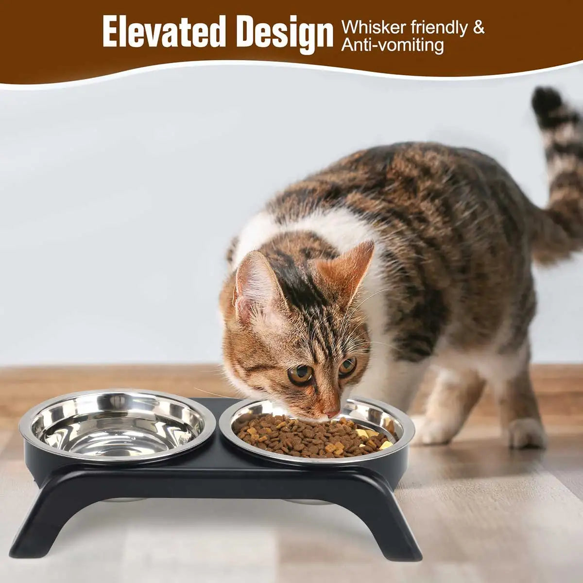 Cat eating from a raised pet feeder with two bowls on a wooden floor.