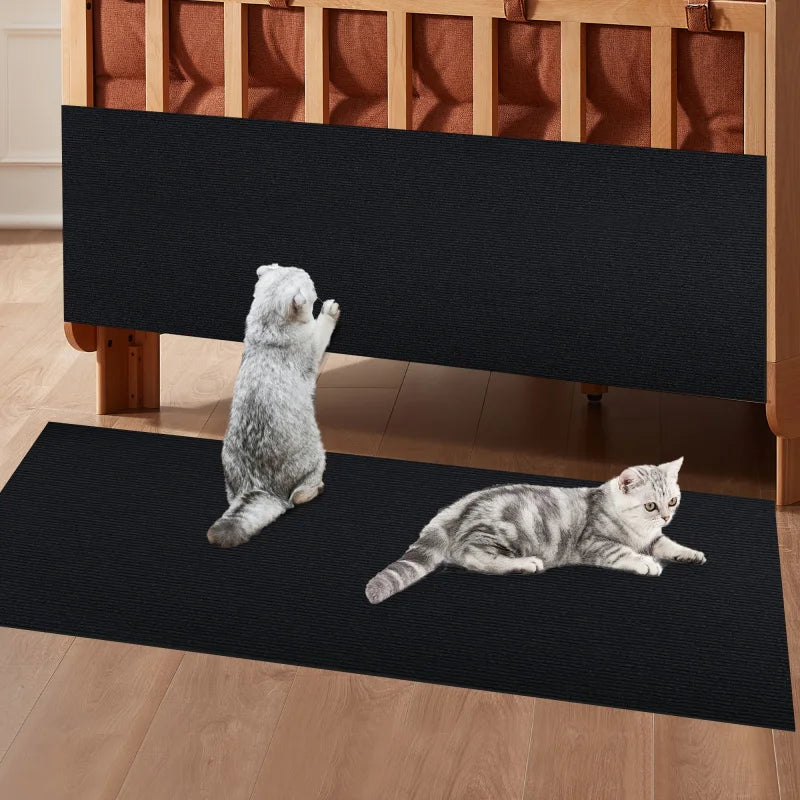 Grey and white cat playing on colorful trimmable scratching mat