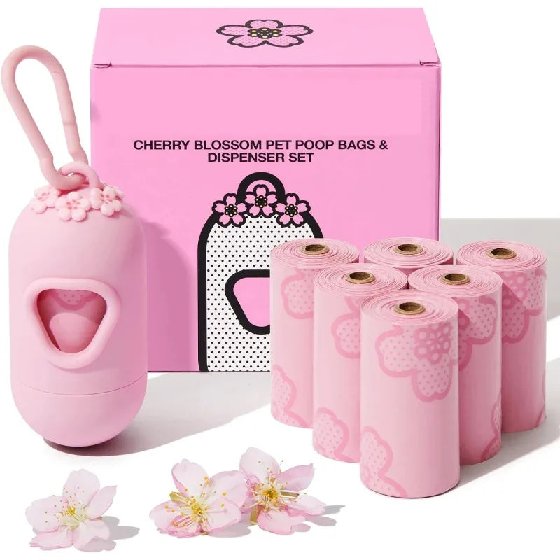 Pink cherry blossom pet poop bags and dispenser set with packaging on a white background