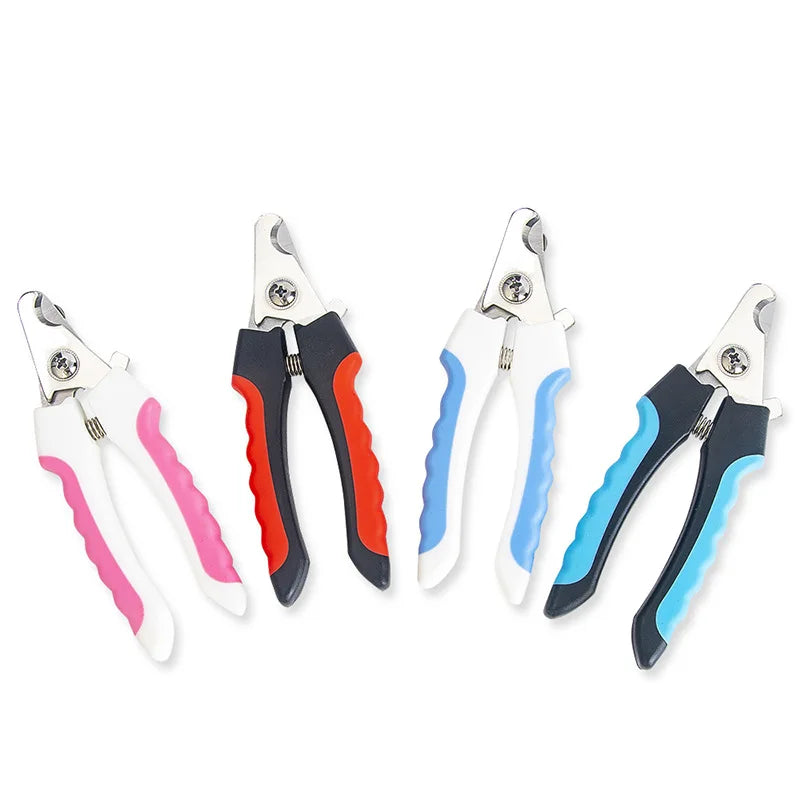 Set of four nail clippers with colorful handles on a white background
